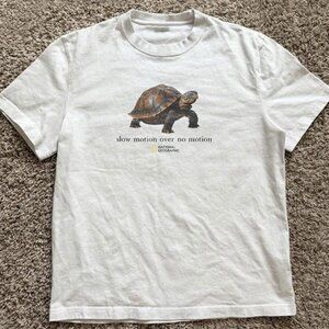 White National Geographic turtle “slow motion over no motion” tee